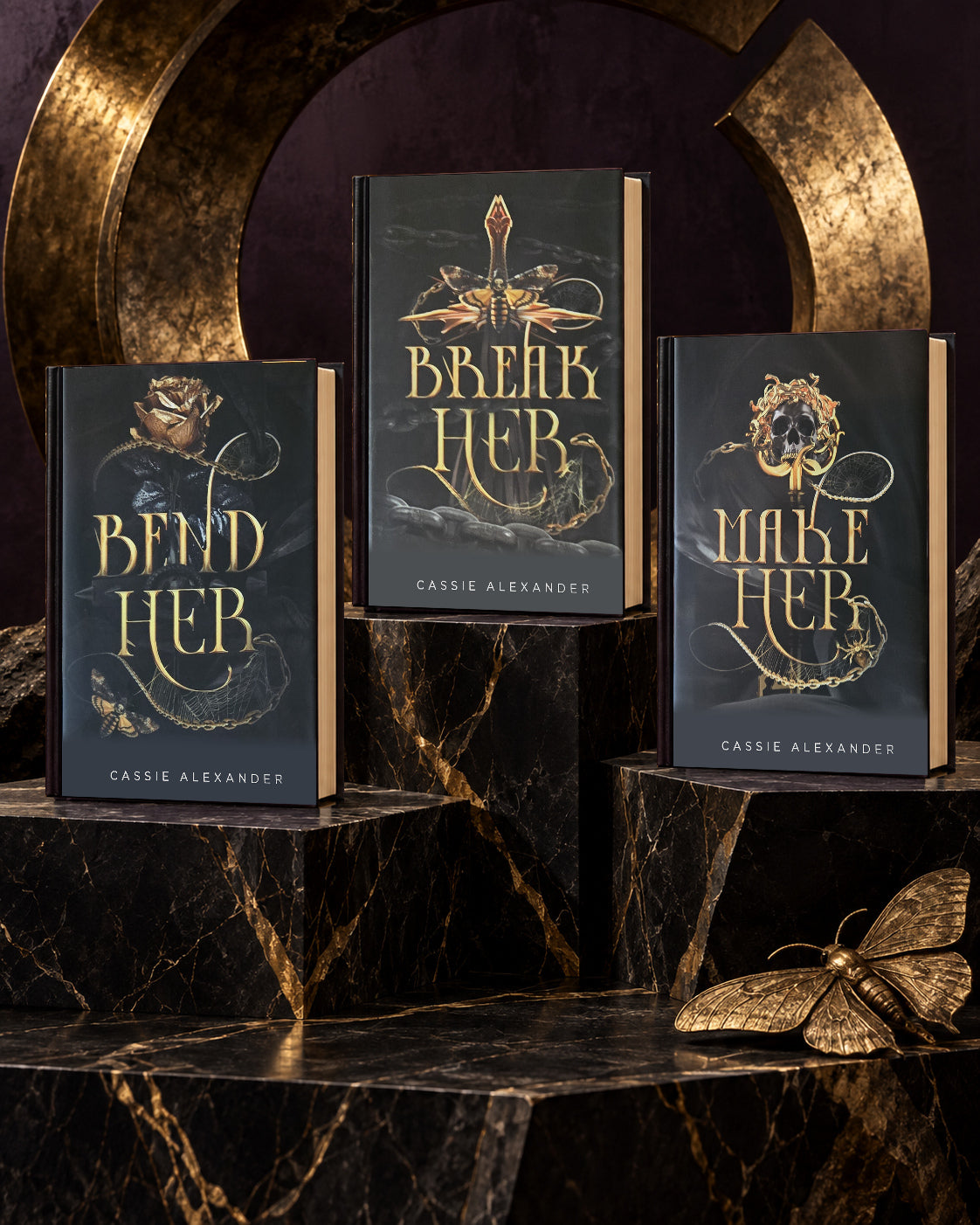 The Transformation Trilogy dust-jacket hardcovers on obsidian and gold plinths