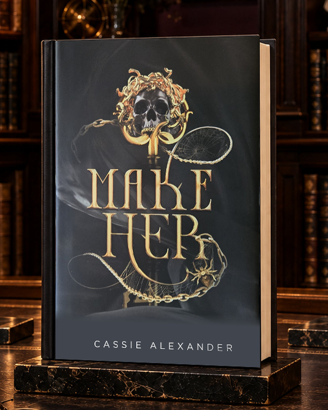 Make Her dust-jacket hardcover in a warm gilded library