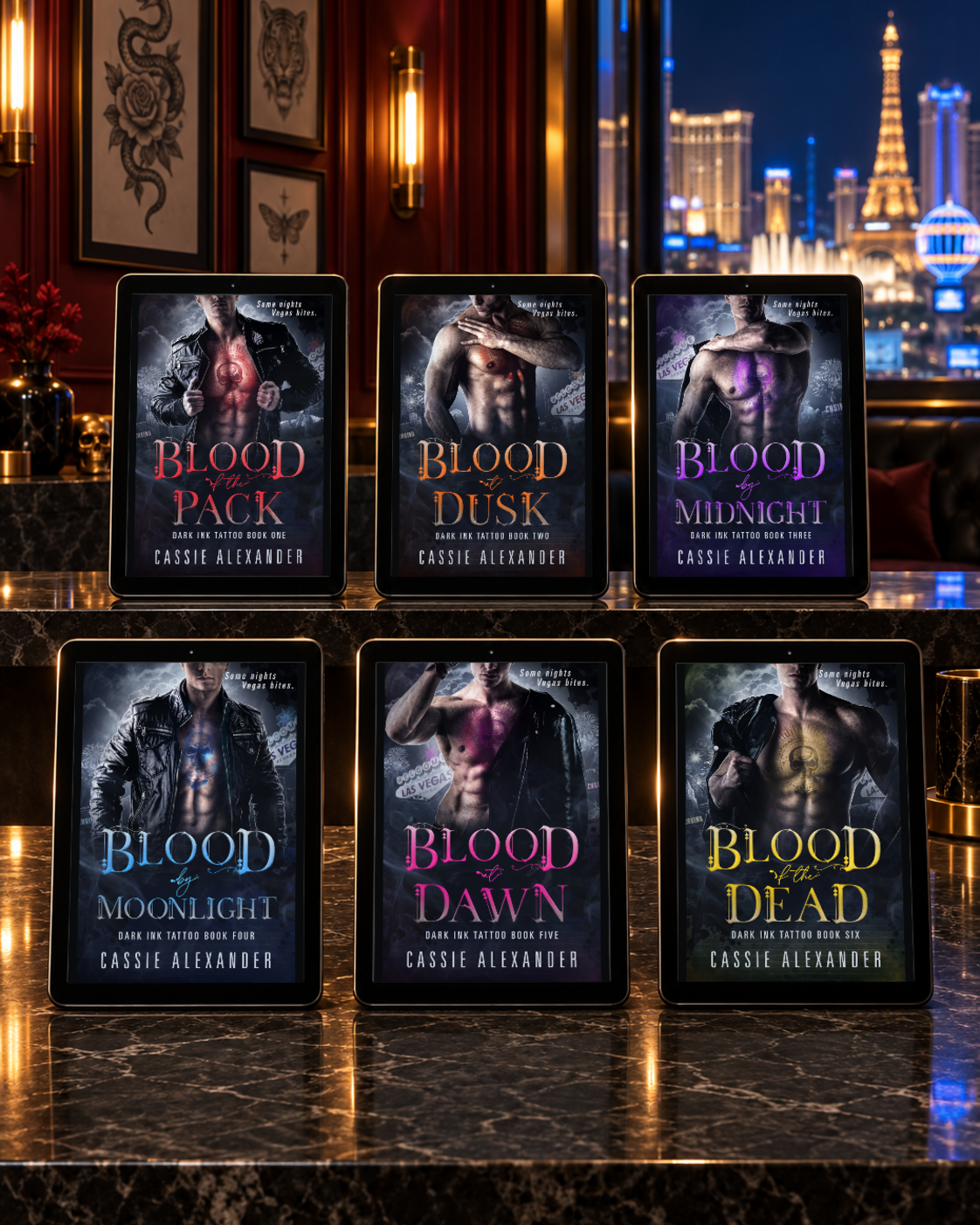 All six Dark Ink Tattoo ebooks on tablets in a Las Vegas tattoo studio
